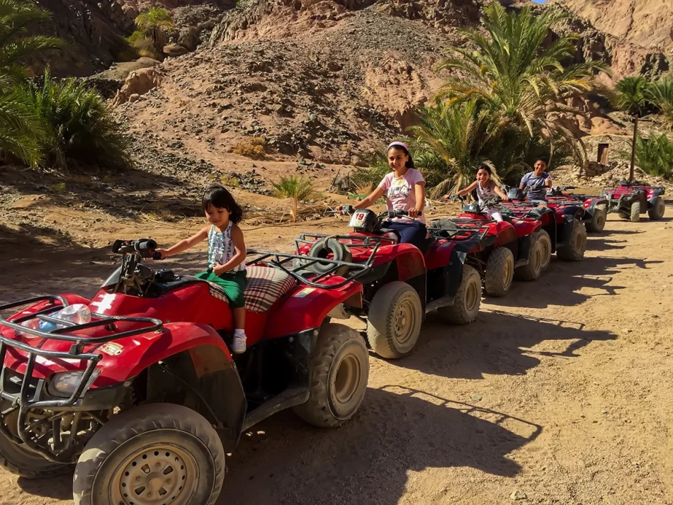 Family enjoying quad biking trip from Dahab