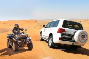 Abu Dhabi Desert Safari with BBQ Dinner, Camel Ride & Sandboarding