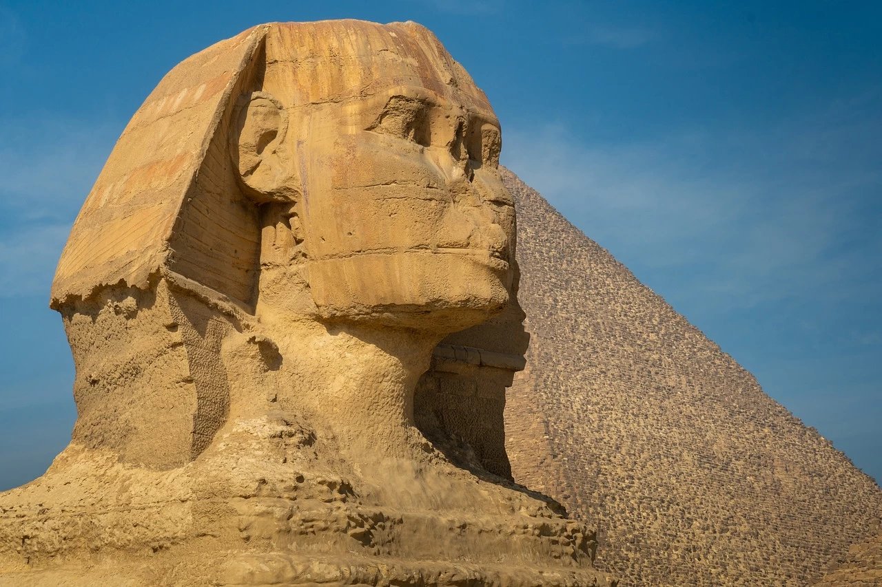 he Great Sphinx of Giza with the Pyramid of Khafre in the background