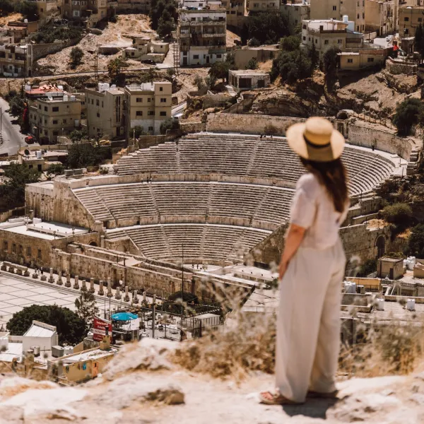 Tourist exploring the ancient Roman Theatre in Amman, Jordan