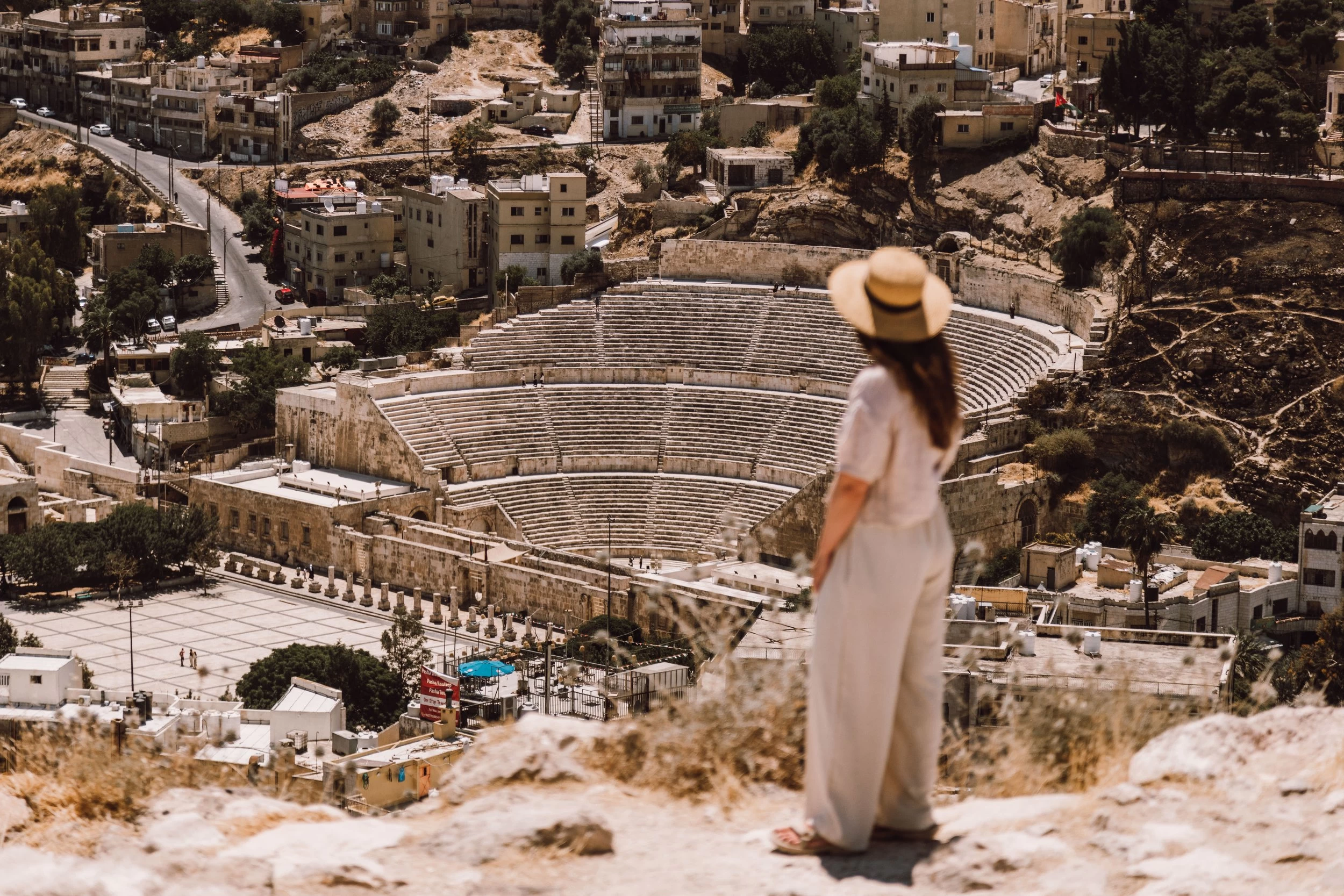 Tourist at Roman Theatre, Amman Tourist exploring the ancient Roman Theatre in Amman, Jordan