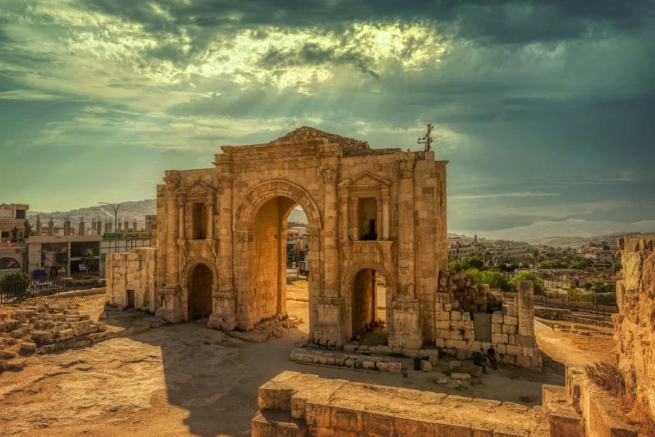 Golden sunset illuminating the Roman columns and ancient ruins of Jerash, Jordan.