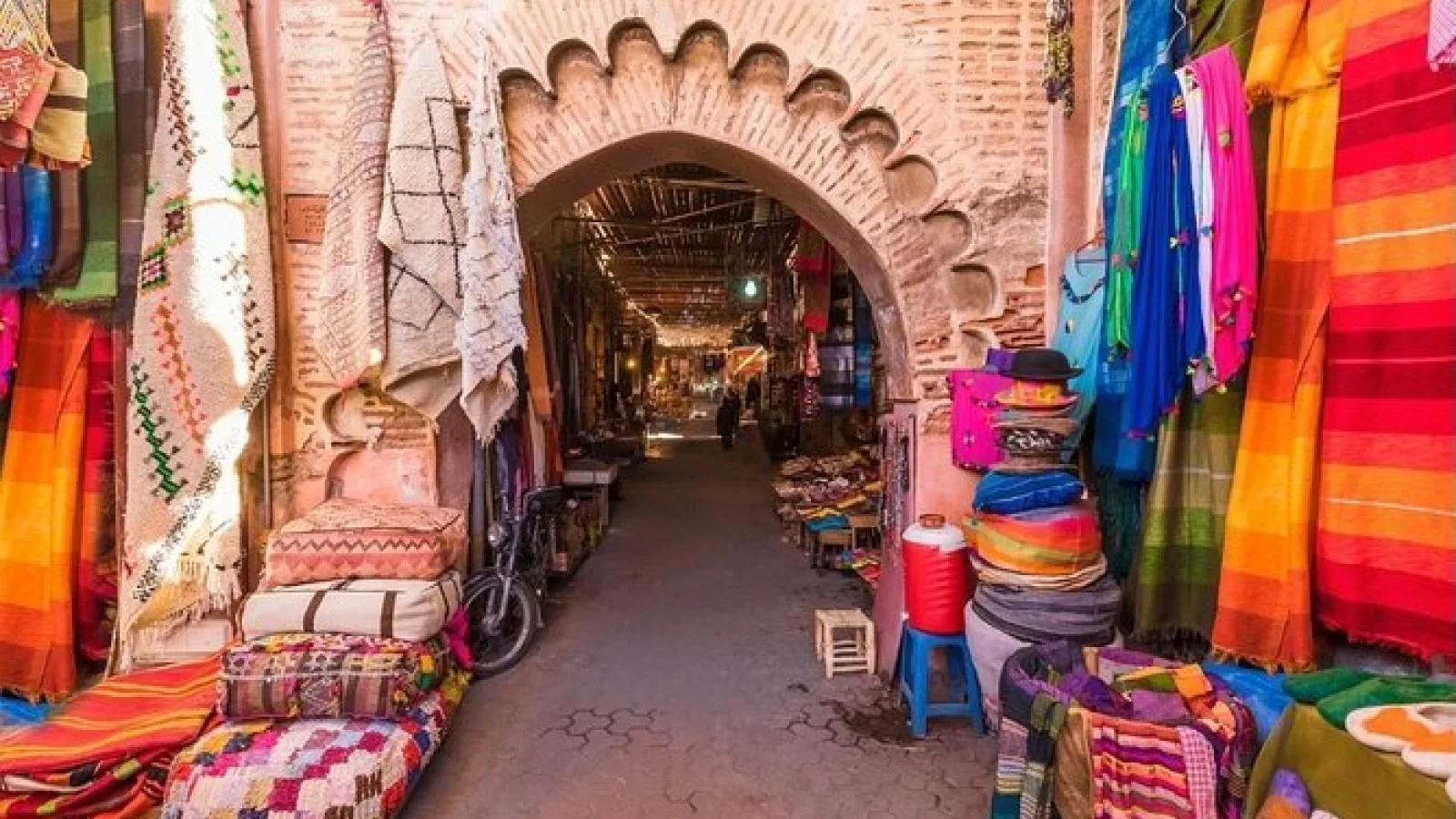 Marrakesh’s medina with vivid walls, hanging lanterns, and local crafts in the marketplace.