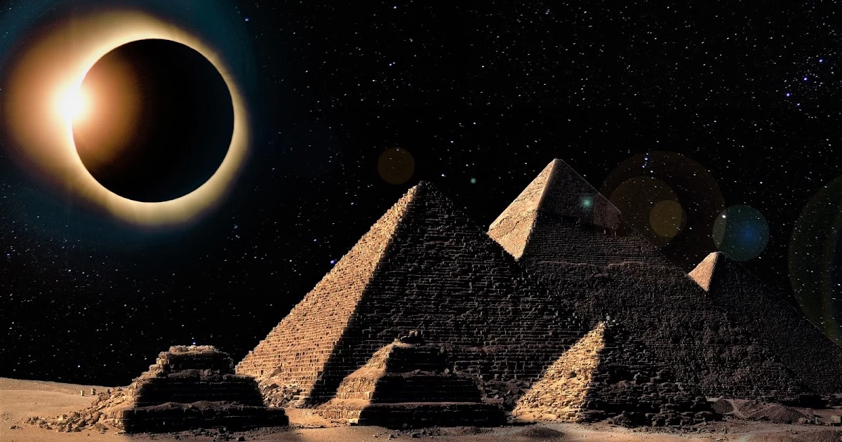 Total solar eclipse above the pyramids of Giza, with the darkened sun creating a dramatic silhouette