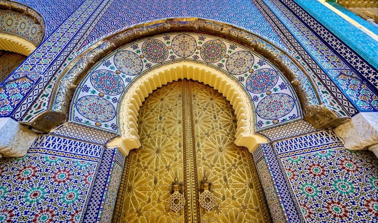 Traditional Moroccan architecture with detailed woodwork and vibrant mosaics in Fes.
