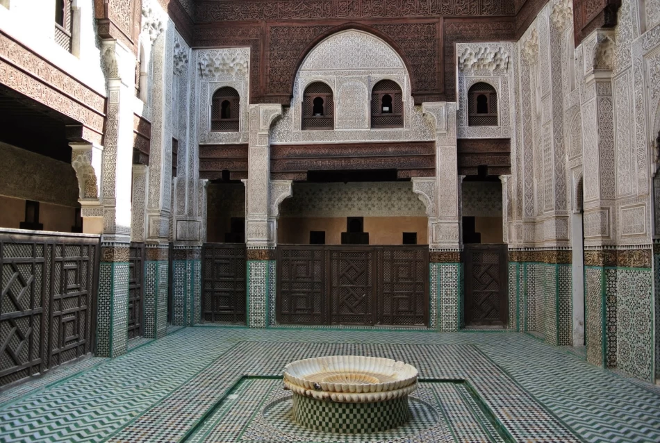 Courtyard and ornate architecture of Bou Inania Medersa in Fez, Morocco,