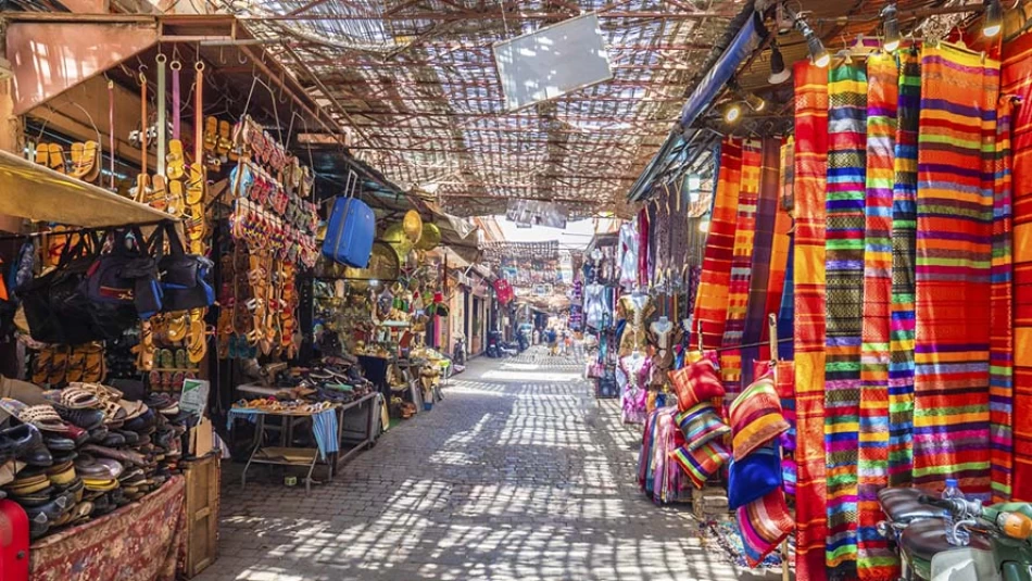Bustling souks in Marrakech, Morocco, filled with colorful stalls, handmade crafts