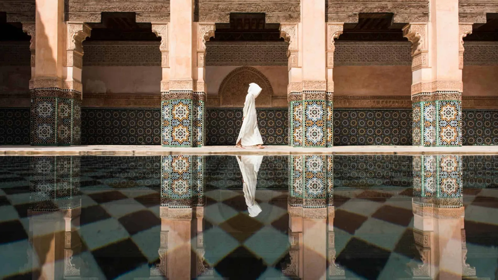 Ornate Moroccan building showcasing intricate arches, mosaic tiles, and traditional design
