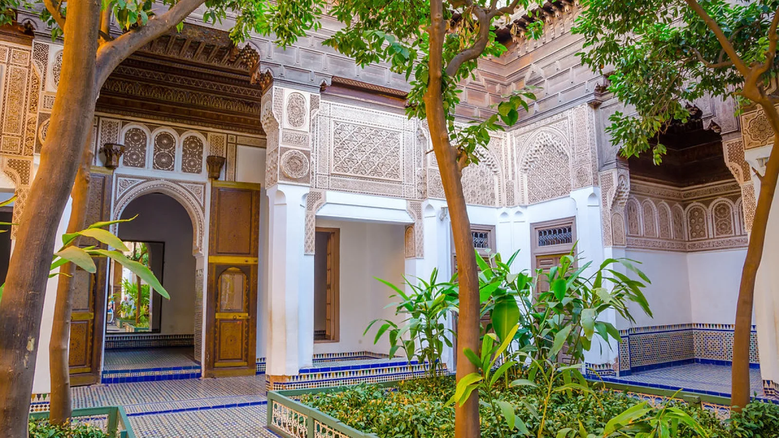 Beautiful green gardens with fountains and pathways at Bahia Palace, Marrakech