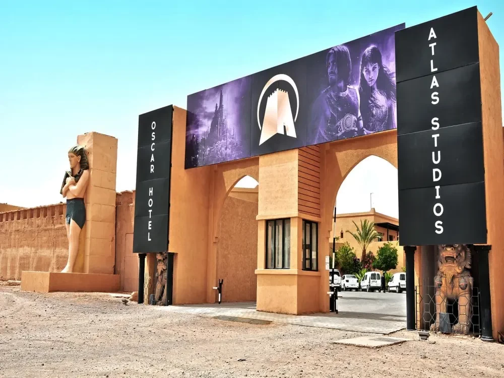 Main entrance of Atlas Studios Morocco in Ouarzazate with iconic movie sets in the background