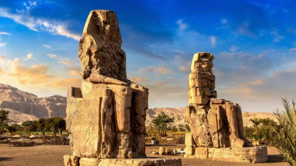 Two massive statues of the Colossi of Memnon standing on the west bank of Luxor