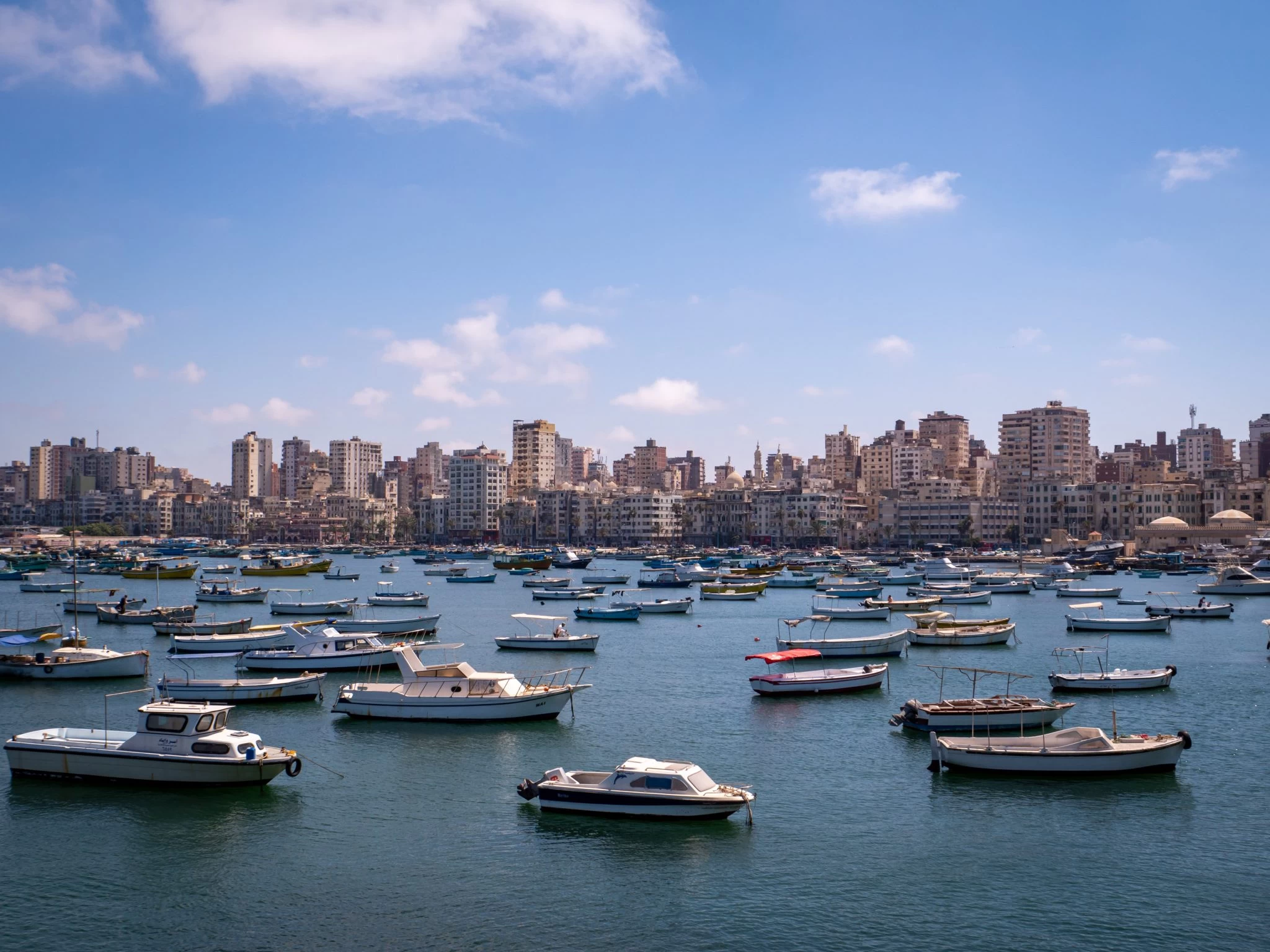 Small boats docked along the Alexandria coastline with view of the Mediterranean Sea