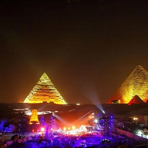 Illuminated Pyramids of Giza during the Sound and Light Show, showcasing Ancient Egyptian history