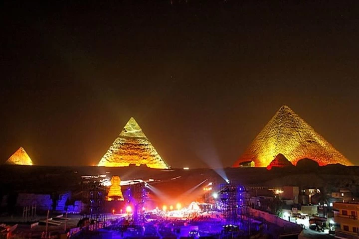 Illuminated Pyramids of Giza during the Sound and Light Show, showcasing Ancient Egyptian history