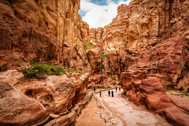 The Siq is a narrow natural gorge leading to Petra's Treasury